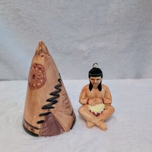 Vintage salt and pepper shaker. Indigenous person and teepee.
